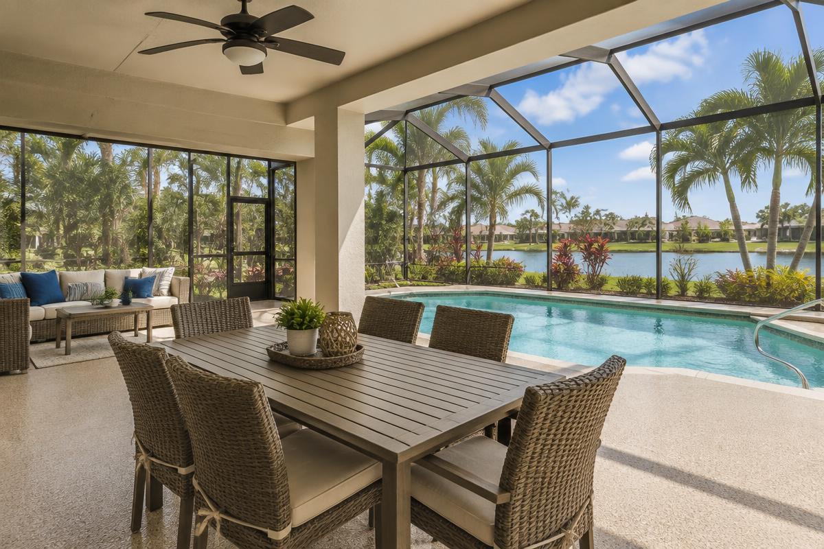 Screened Florida lanai with a coated concrete floor beside a pool